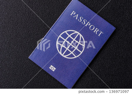 A passport with a foreign visa for flights, travel, and vacations abroad. An international passport A passport with a foreign visa for flights, travel, and vacations abroad. An international passport 136971097