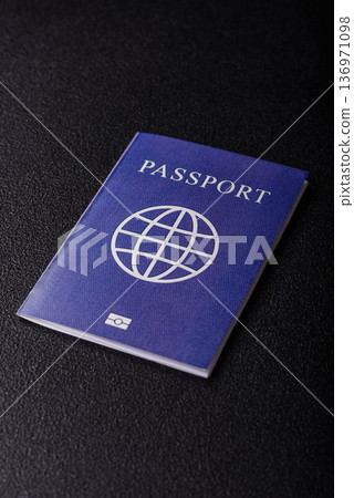 A passport with a foreign visa for flights, travel, and vacations abroad. An international passport 136971098