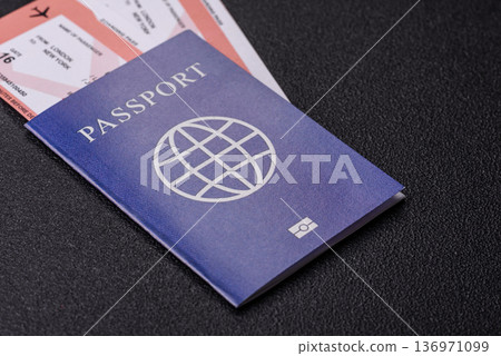 A passport with a foreign visa for flights, travel, and vacations abroad. An international passport A passport with a foreign visa for flights, travel, and vacations abroad. An international passport 136971099
