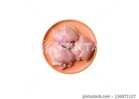 Chicken thigh fillet, skinless and boneless meat for grilling or barbecue. Chicken thigh fillet 136971127