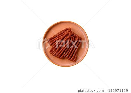 Smoked cabanossi, thin salami sausage, meat sticks, or snacks. Cabanossi sausage 136971129