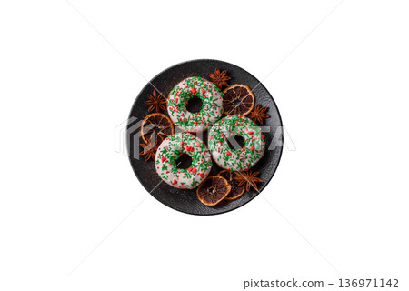 Christmas donuts or doughnuts, holiday winter sweets with sprinkles. Christmas donuts Christmas donuts or doughnuts, holiday winter sweets with sprinkles. Christmas donuts 136971142