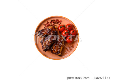 Grilled or bbq pork ribs with sauce, a food prepared for dinner. Grilled ribs 136971144