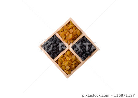 Sweet, dry, golden or yellow raisin made from grapes are a healthy, nutritious food. Golden raisins Sweet, dry, golden or yellow raisin made from grapes are a healthy, nutritious food. Golden raisins 136971157