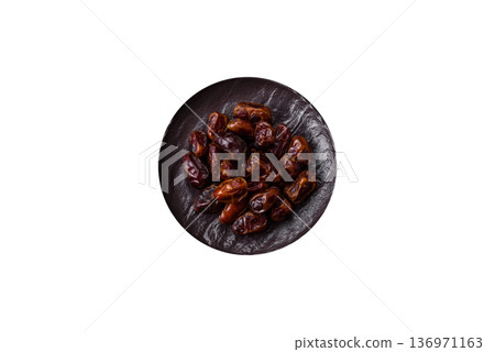 Dried sweet dates, natural tropical fruits for a healthy diet. Dried dates Dried sweet dates, natural tropical fruits for a healthy diet. Dried dates 136971163