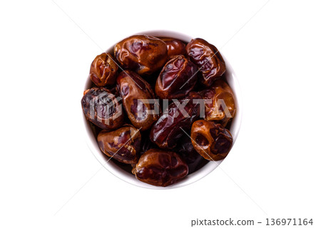 Dried sweet dates, natural tropical fruits for a healthy diet. Dried dates Dried sweet dates, natural tropical fruits for a healthy diet. Dried dates 136971164