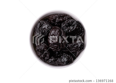 Sweet dried plums or prunes, organic dehydrated fruit for dietary nutrition. Prunes or dried plums Sweet dried plums or prunes, organic dehydrated fruit for dietary nutrition. Prunes or dried plums 136971168