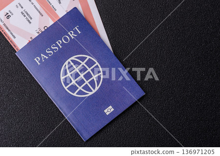 A passport with a foreign visa for flights, travel, and vacations abroad. An international passport A passport with a foreign visa for flights, travel, and vacations abroad. An international passport 136971205