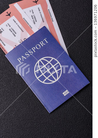 A passport with a foreign visa for flights, travel, and vacations abroad. An international passport A passport with a foreign visa for flights, travel, and vacations abroad. An international passport 136971206