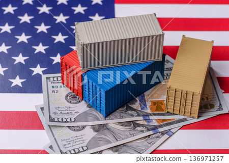 Cargo containers on the US flag as a conceptual backdrop for goods export and logistics. Cargo containers Cargo containers on the US flag as a conceptual backdrop for goods export and logistics. Cargo containers 136971257
