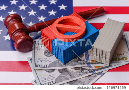 The cargo container ban on the US flag as a conceptual backdrop. The cargo container embargo The cargo container ban on the US flag as a conceptual backdrop. The cargo container embargo 136971269