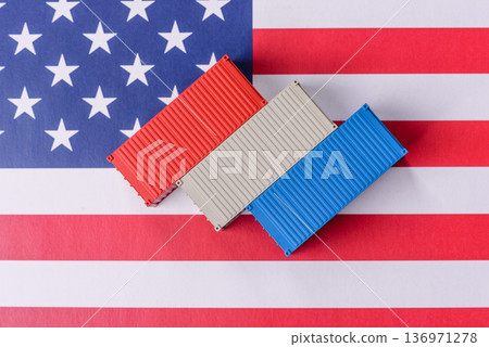 Cargo containers on the US flag as a conceptual backdrop for goods export and logistics. Cargo containers 136971278