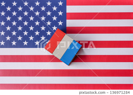Cargo containers on the US flag as a conceptual backdrop for goods export and logistics. Cargo containers Cargo containers on the US flag as a conceptual backdrop for goods export and logistics. Cargo containers 136971284