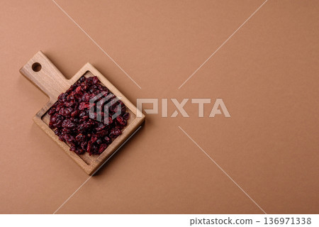 Dried sweet cranberries, natural berries for a healthy diet. Dried cranberries Dried sweet cranberries, natural berries for a healthy diet. Dried cranberries 136971338