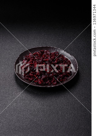 Dried sweet cranberries, natural berries for a healthy diet. Dried cranberries Dried sweet cranberries, natural berries for a healthy diet. Dried cranberries 136971344