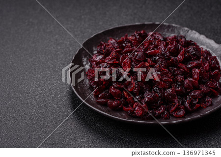 Dried sweet cranberries, natural berries for a healthy diet. Dried cranberries Dried sweet cranberries, natural berries for a healthy diet. Dried cranberries 136971345
