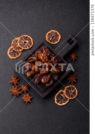 Dried sweet dates, natural tropical fruits for a healthy diet. Dried dates 136971376