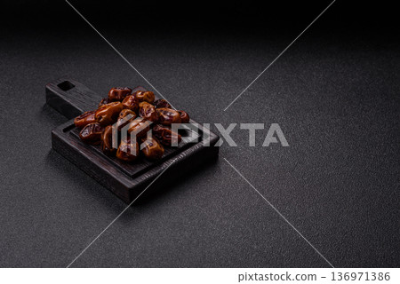 Dried sweet dates, natural tropical fruits for a healthy diet. Dried dates 136971386