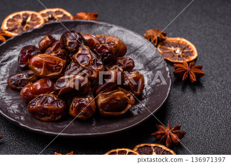 Dried sweet dates, natural tropical fruits for a healthy diet. Dried dates Dried sweet dates, natural tropical fruits for a healthy diet. Dried dates 136971397