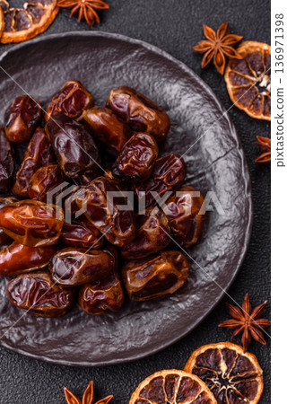 Dried sweet dates, natural tropical fruits for a healthy diet. Dried dates Dried sweet dates, natural tropical fruits for a healthy diet. Dried dates 136971398