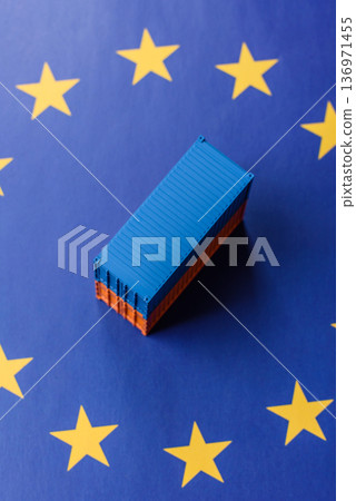 Cargo containers on the EU flag as a conceptual backdrop. Cargo containers on the EU flag 136971455
