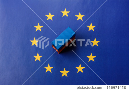 Cargo containers on the EU flag as a conceptual backdrop. Cargo containers on the EU flag 136971458