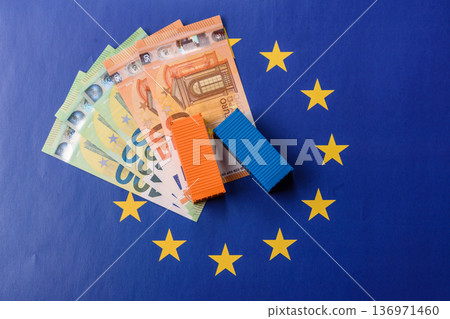 Cargo containers on the EU flag as a conceptual backdrop. Cargo containers on the EU flag 136971460