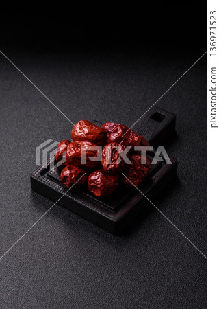 Red dried dates, the Chinese sweet fruit jujube, as a healthy food. Red dates, jujube Red dried dates, the Chinese sweet fruit jujube, as a healthy food. Red dates, jujube 136971523
