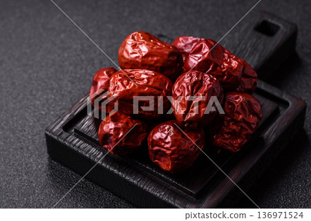 Red dried dates, the Chinese sweet fruit jujube, as a healthy food. Red dates, jujube Red dried dates, the Chinese sweet fruit jujube, as a healthy food. Red dates, jujube 136971524