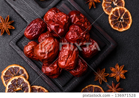 Red dried dates, the Chinese sweet fruit jujube, as a healthy food. Red dates, jujube Red dried dates, the Chinese sweet fruit jujube, as a healthy food. Red dates, jujube 136971528
