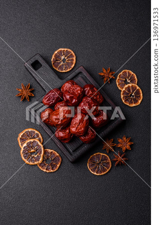 Red dried dates, the Chinese sweet fruit jujube, as a healthy food. Red dates, jujube Red dried dates, the Chinese sweet fruit jujube, as a healthy food. Red dates, jujube 136971533