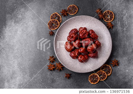 Red dried dates, the Chinese sweet fruit jujube, as a healthy food. Red dates, jujube Red dried dates, the Chinese sweet fruit jujube, as a healthy food. Red dates, jujube 136971536