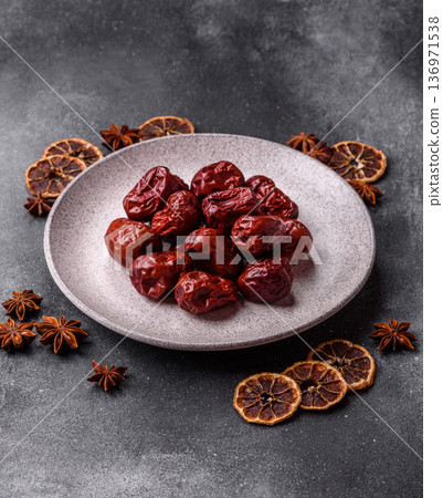 Red dried dates, the Chinese sweet fruit jujube, as a healthy food. Red dates, jujube Red dried dates, the Chinese sweet fruit jujube, as a healthy food. Red dates, jujube 136971538
