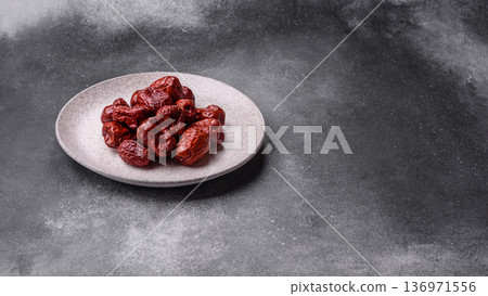 Red dried dates, the Chinese sweet fruit jujube, as a healthy food. Red dates, jujube Red dried dates, the Chinese sweet fruit jujube, as a healthy food. Red dates, jujube 136971556