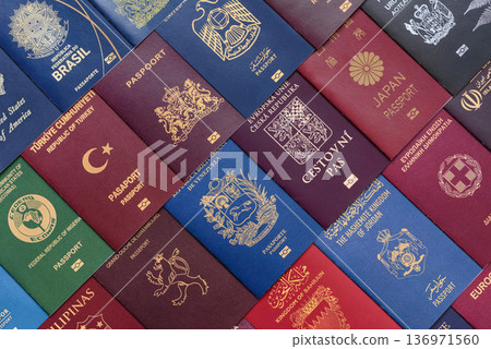 Passports of citizens of different countries of the world. Passports background Passports of citizens of different countries of the world. Passports background 136971560