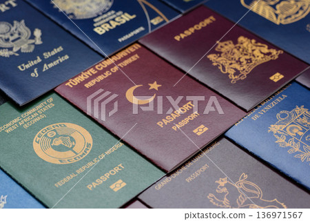 Passports of citizens of different countries of the world. Passports background Passports of citizens of different countries of the world. Passports background 136971567