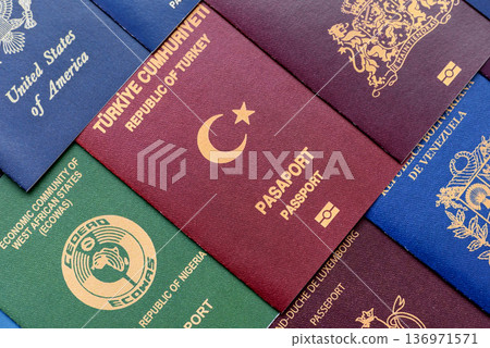 Passports of citizens of different countries of the world. Passports background Passports of citizens of different countries of the world. Passports background 136971571