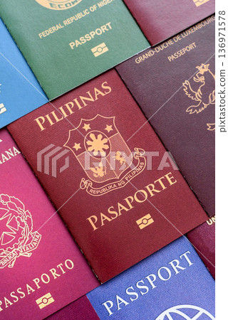 Passports of citizens of different countries of the world. Passports background Passports of citizens of different countries of the world. Passports background 136971578