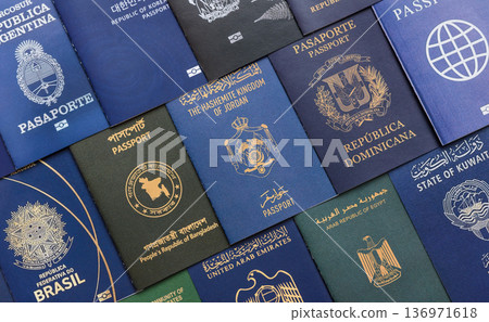 Passports of citizens of different countries of the world. Passports background Passports of citizens of different countries of the world. Passports background 136971618