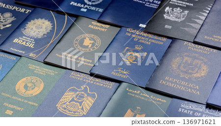 Passports of citizens of different countries of the world. Passports background Passports of citizens of different countries of the world. Passports background 136971621