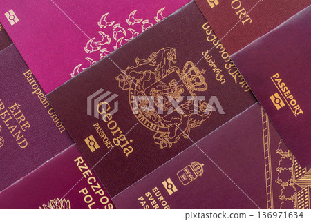 Passports of citizens of different countries of the world. Passports background Passports of citizens of different countries of the world. Passports background 136971634