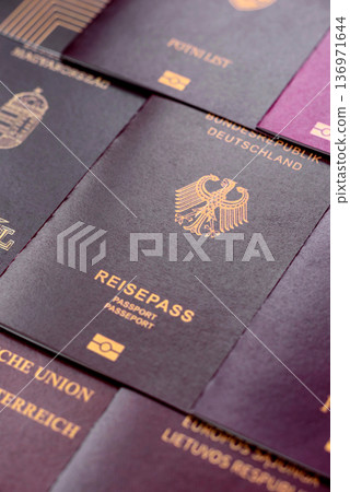 Passports of citizens of different countries of the world. Passports background Passports of citizens of different countries of the world. Passports background 136971644