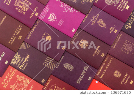 Passports of citizens of different countries of the world. Passports background Passports of citizens of different countries of the world. Passports background 136971650