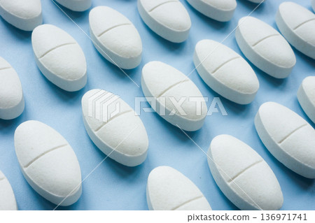 White pills pattern symbolizing daily medication routine. White pills pattern symbolizing daily medication routine. 136971741
