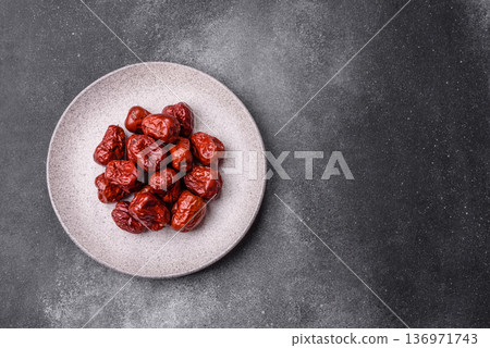 Red dried dates, the Chinese sweet fruit jujube, as a healthy food. Red dates, jujube Red dried dates, the Chinese sweet fruit jujube, as a healthy food. Red dates, jujube 136971743