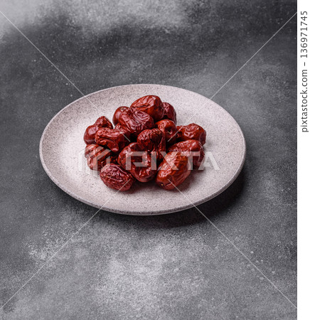 Red dried dates, the Chinese sweet fruit jujube, as a healthy food. Red dates, jujube Red dried dates, the Chinese sweet fruit jujube, as a healthy food. Red dates, jujube 136971745