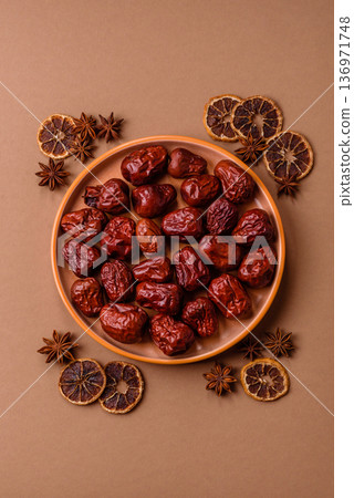 Red dried dates, the Chinese sweet fruit jujube, as a healthy food. Red dates, jujube Red dried dates, the Chinese sweet fruit jujube, as a healthy food. Red dates, jujube 136971748