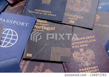 Passports of citizens of different countries of the world. Passports background Passports of citizens of different countries of the world. Passports background 136971763