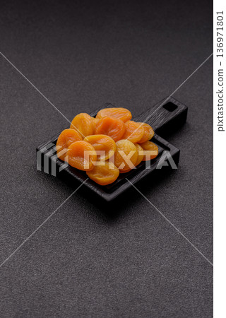 Dried apricots are a sweet, healthy fruit for vegans and vegetarians. Dried apricot Dried apricots are a sweet, healthy fruit for vegans and vegetarians. Dried apricot 136971801