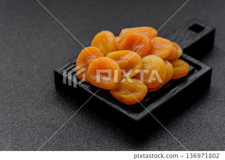 Dried apricots are a sweet, healthy fruit for vegans and vegetarians. Dried apricot 136971802